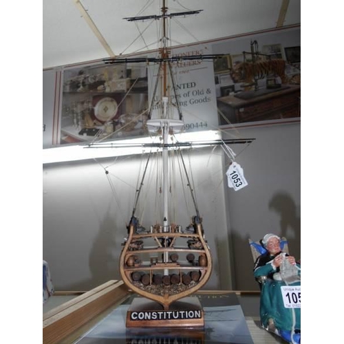 1053 - A hand built 'cut part' model of 'USS Constitution' with book