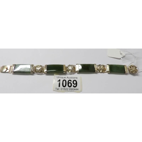 1069 - A jade and floral gilt bracelet