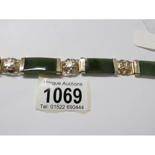 1069 - A jade and floral gilt bracelet