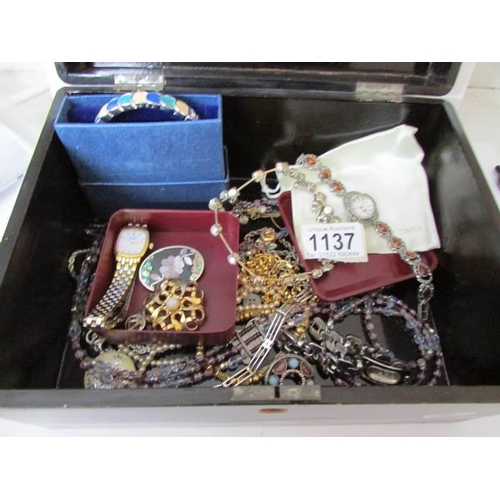 1137 - A lacquered box of costume jewellery including watches, some silver, gold chain etc