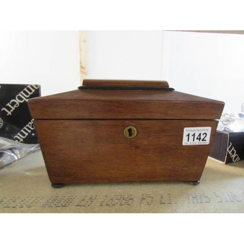 1142 - A mahogany sarcophogus tea caddy