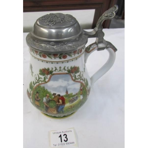 13 - A German beer stein with pewter lid