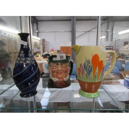 20 - A Clarice Cliff jug a/f, a Doulton Lambeth vase a/f and a Royal Doulton character jug 'Mr Pickwick'