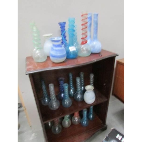 217 - Approximately 20 hand made glass vases