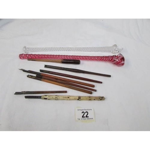 22 - A quantity of old dip pens and 2 twisted glass items