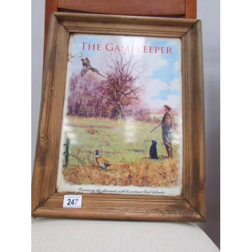 247 - A waxed pine mounted 'The Gamekeeper' tin pub sign