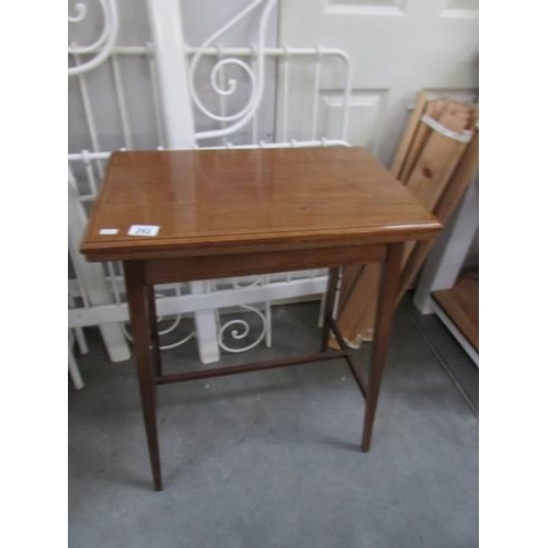 282 - An inlaid occasional table