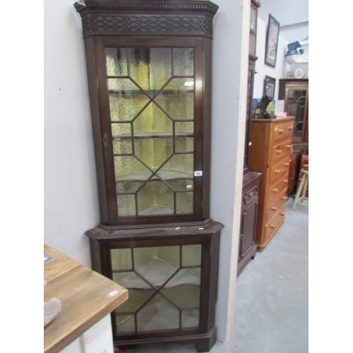 295 - An astragal glazed corner cabinet