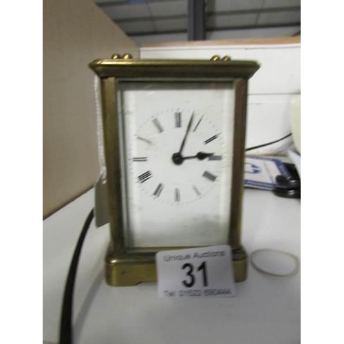 31 - A brass carriage clock