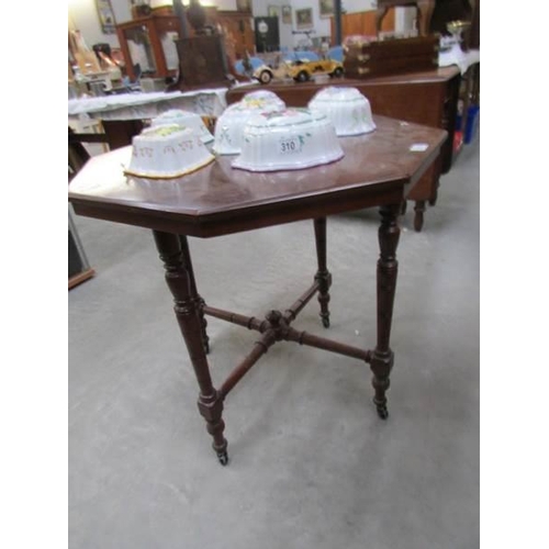 311 - An octagonal mahogany table