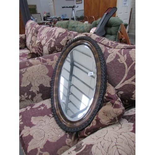 314 - A Victorian oval bevel edged mirror a/f