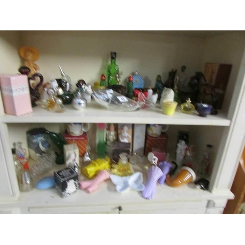 62 - 2 shelves of Avon and other perfume bottles