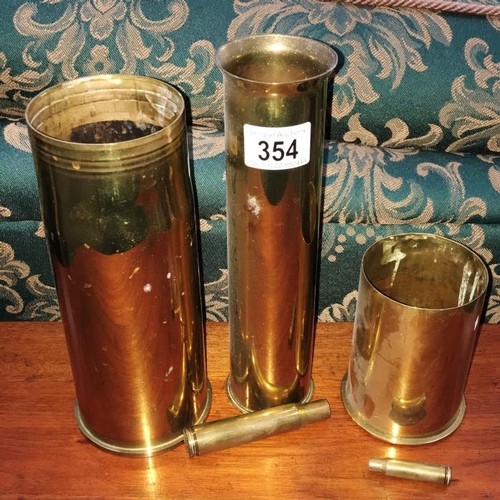 354 - 4 Brass gunshells