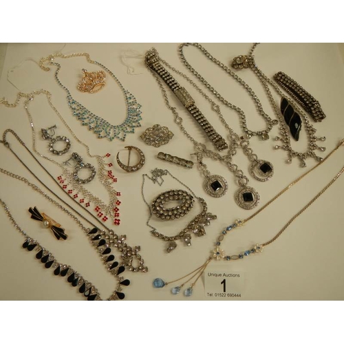 1 - A mixed lot of costume jewellery including necklaces, bracelets, brooches etc.,