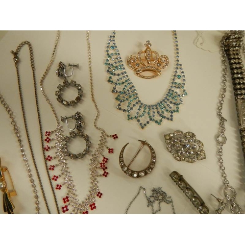 1 - A mixed lot of costume jewellery including necklaces, bracelets, brooches etc.,