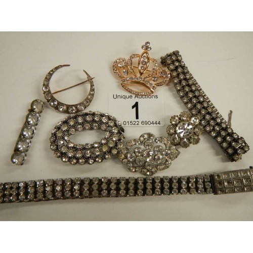 1 - A mixed lot of costume jewellery including necklaces, bracelets, brooches etc.,