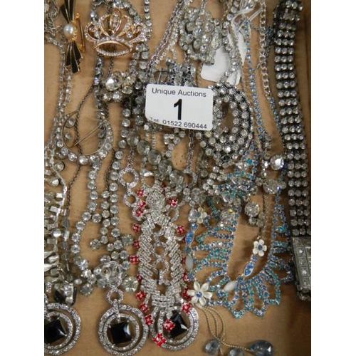 1 - A mixed lot of costume jewellery including necklaces, bracelets, brooches etc.,