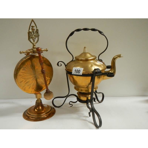 100 - A Victorian brass kettle on stand and an early 20th century brass dinner gong.