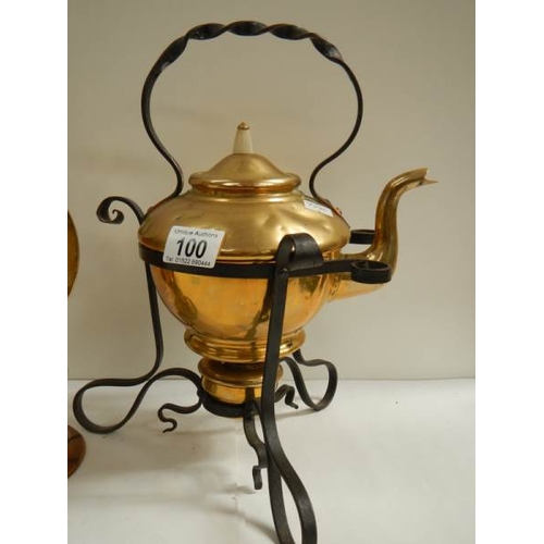 100 - A Victorian brass kettle on stand and an early 20th century brass dinner gong.