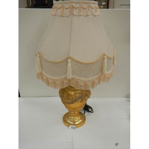 114 - A good modern gilded table lamp with fringed shade, 28'' tall.