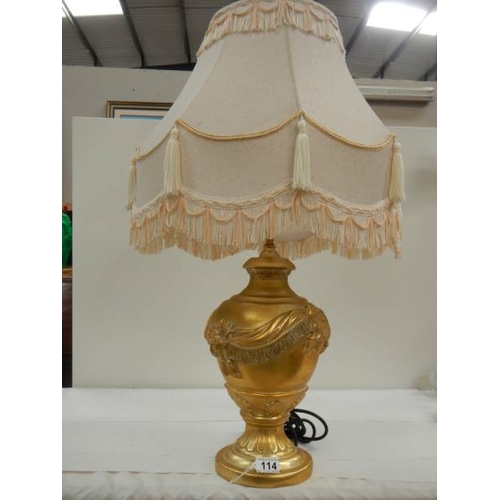 114 - A good modern gilded table lamp with fringed shade, 28'' tall.