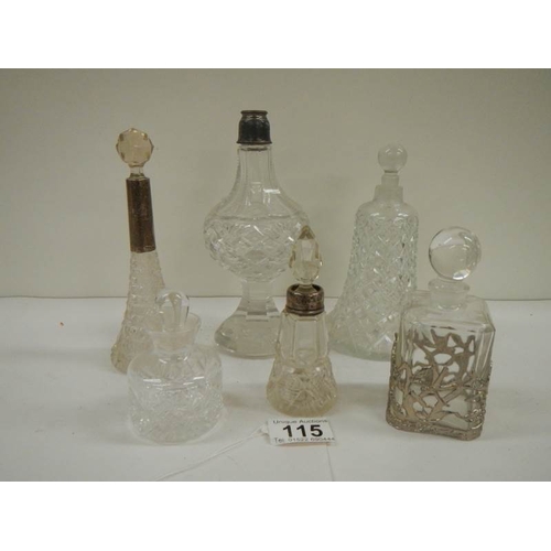 115 - 6 old perfume bottles, some with silver tops.