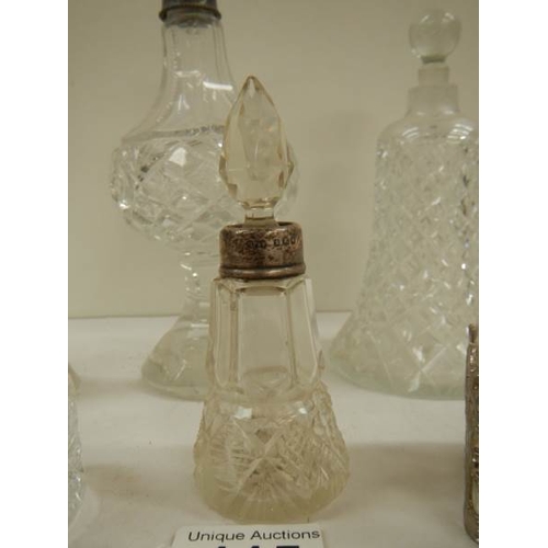 115 - 6 old perfume bottles, some with silver tops.