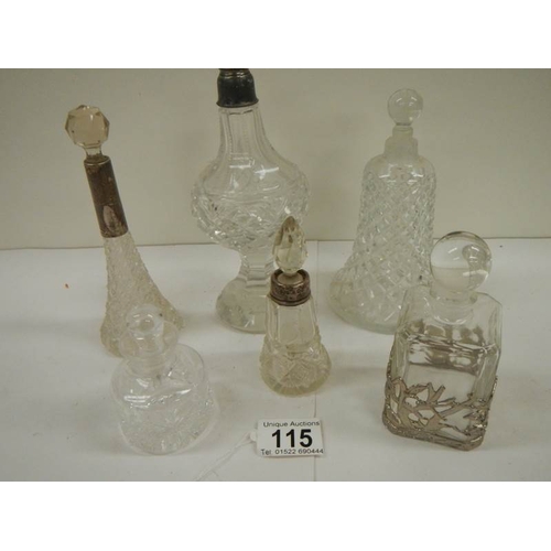 115 - 6 old perfume bottles, some with silver tops.