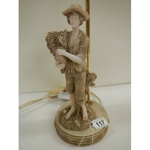 117 - A mid 20th century table lamp surmouted fruit picker, 23'' tall.