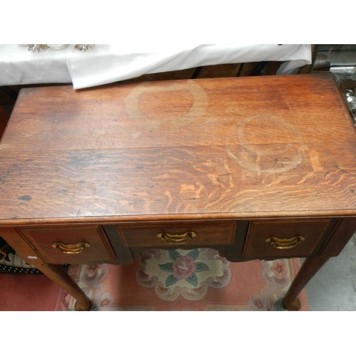 120 - A Victorian oak 3 drawer lowboy.