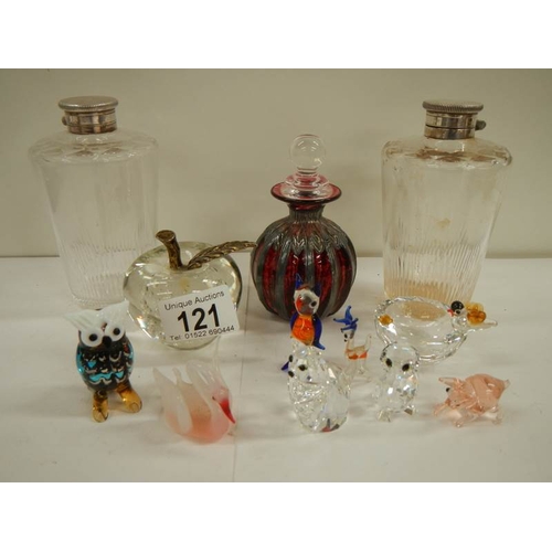 121 - A mixed lot of glass including scent bottles, paperweight, animals etc.,