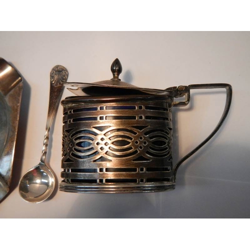 13 - A silver mustard pot with spoons, a Silver pin dish, a silver ash tray and a silver cream jug 138g