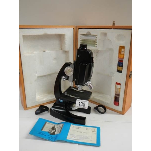 135 - A model E power zoom microscope.