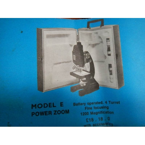 135 - A model E power zoom microscope.