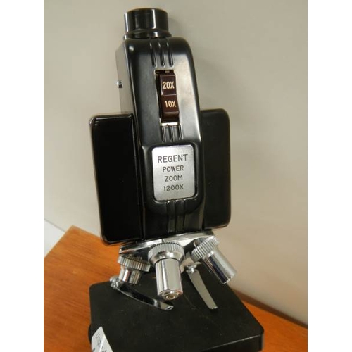 135 - A model E power zoom microscope.