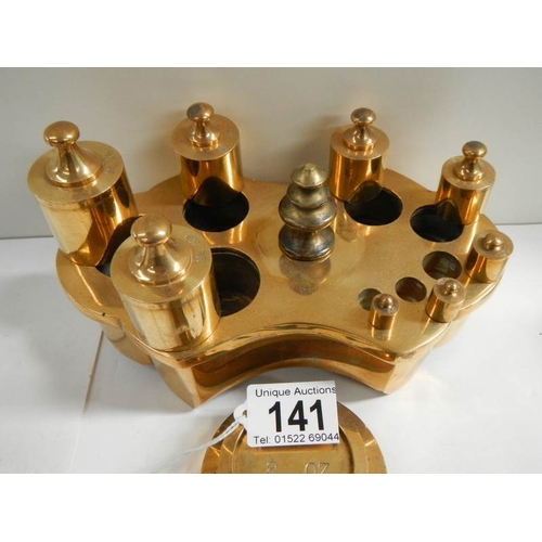 141 - A collection of various brass weights