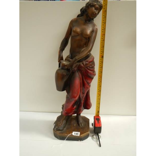 145 - A tall plaster figure with original paintwork, 26'' tall and in good condition.