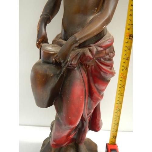 145 - A tall plaster figure with original paintwork, 26'' tall and in good condition.