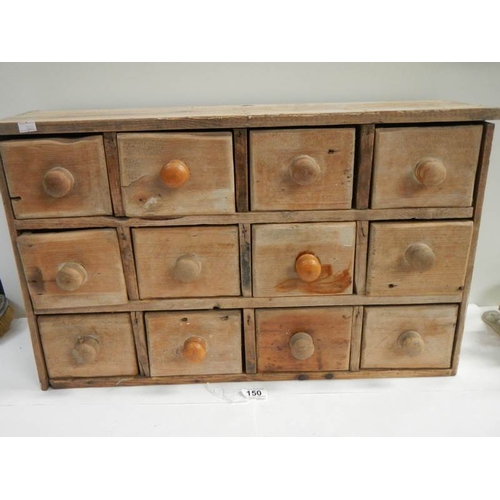 150 - A 12 drawer spice chest, 25'' wide by 15.5'' tall.