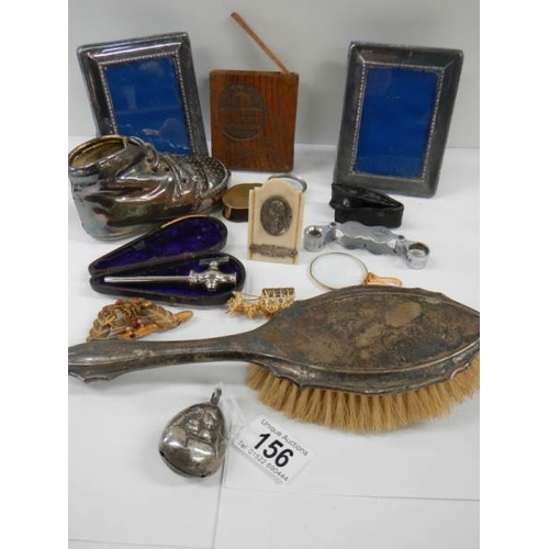 156 - A mixed lot of interesting items including silver rattle, brush etc.,