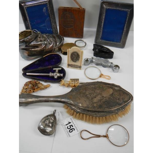 156 - A mixed lot of interesting items including silver rattle, brush etc.,