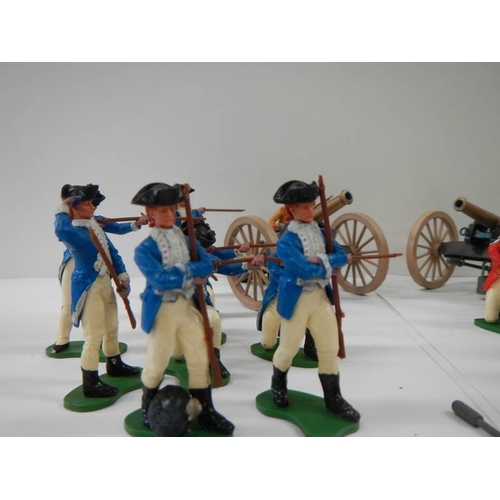 158 - A mixed lot of Britain's soldiers and 2 cannons with moving parts.