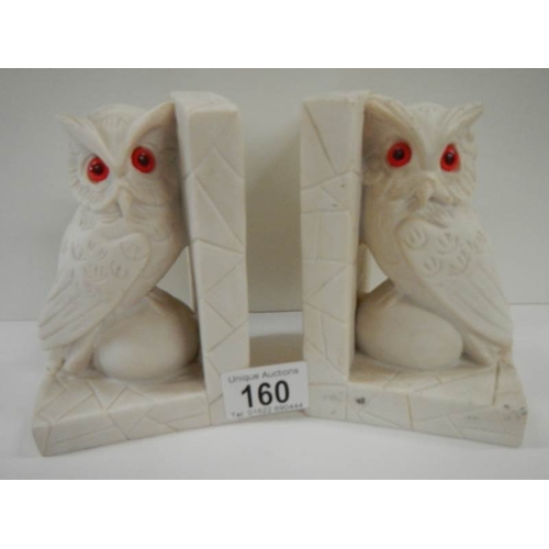 160 - A pair of alabaster owl bookends.