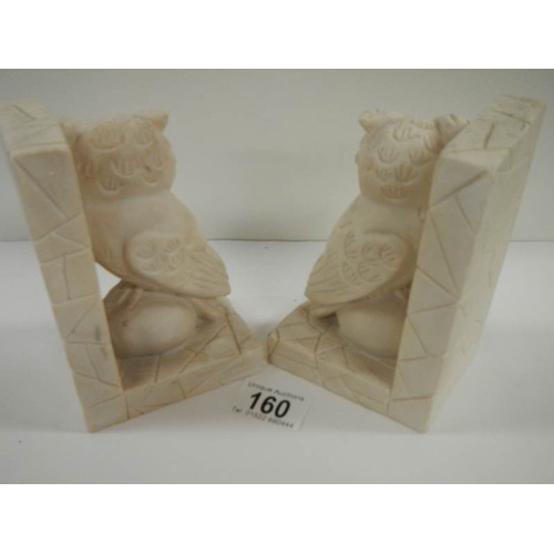 160 - A pair of alabaster owl bookends.