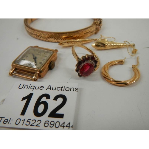 162 - A mixed lot of gold items including ruby ring, earrings etc.,