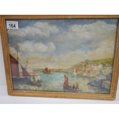 164 - A framed and glazed watercolour of a Cornish fishing village.