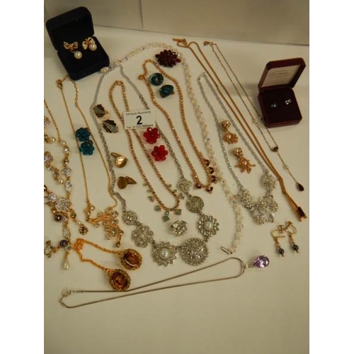 2 - A mixed lot of costume jewellery including necklaces, earrings, brooches etc.,