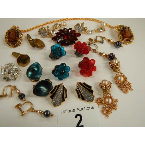 2 - A mixed lot of costume jewellery including necklaces, earrings, brooches etc.,