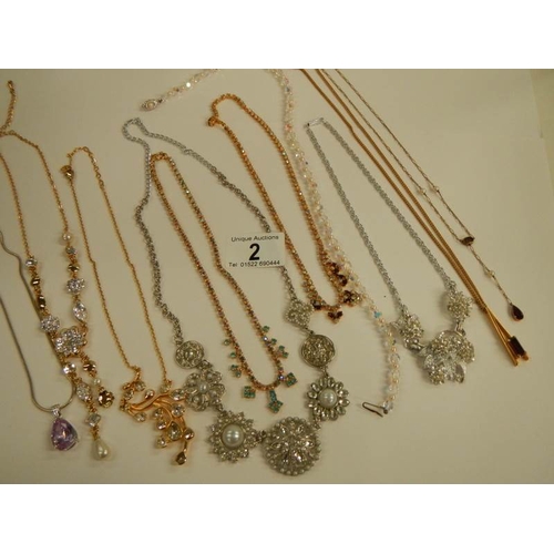 2 - A mixed lot of costume jewellery including necklaces, earrings, brooches etc.,