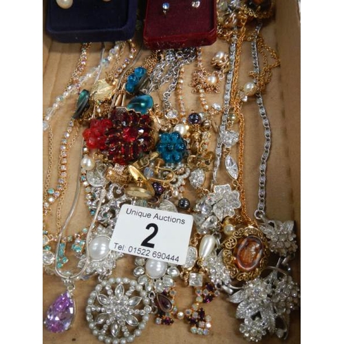 2 - A mixed lot of costume jewellery including necklaces, earrings, brooches etc.,